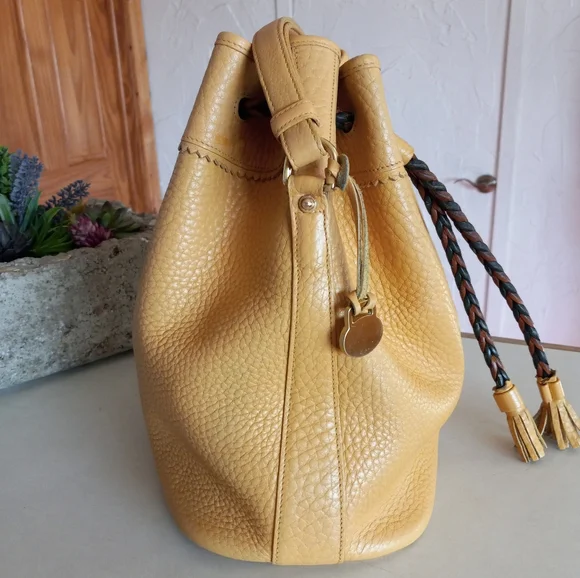 Dooney & Bourke Vintage, Teton Drawstring Bag in solid Palomino Yellow - Picture 6 of 12